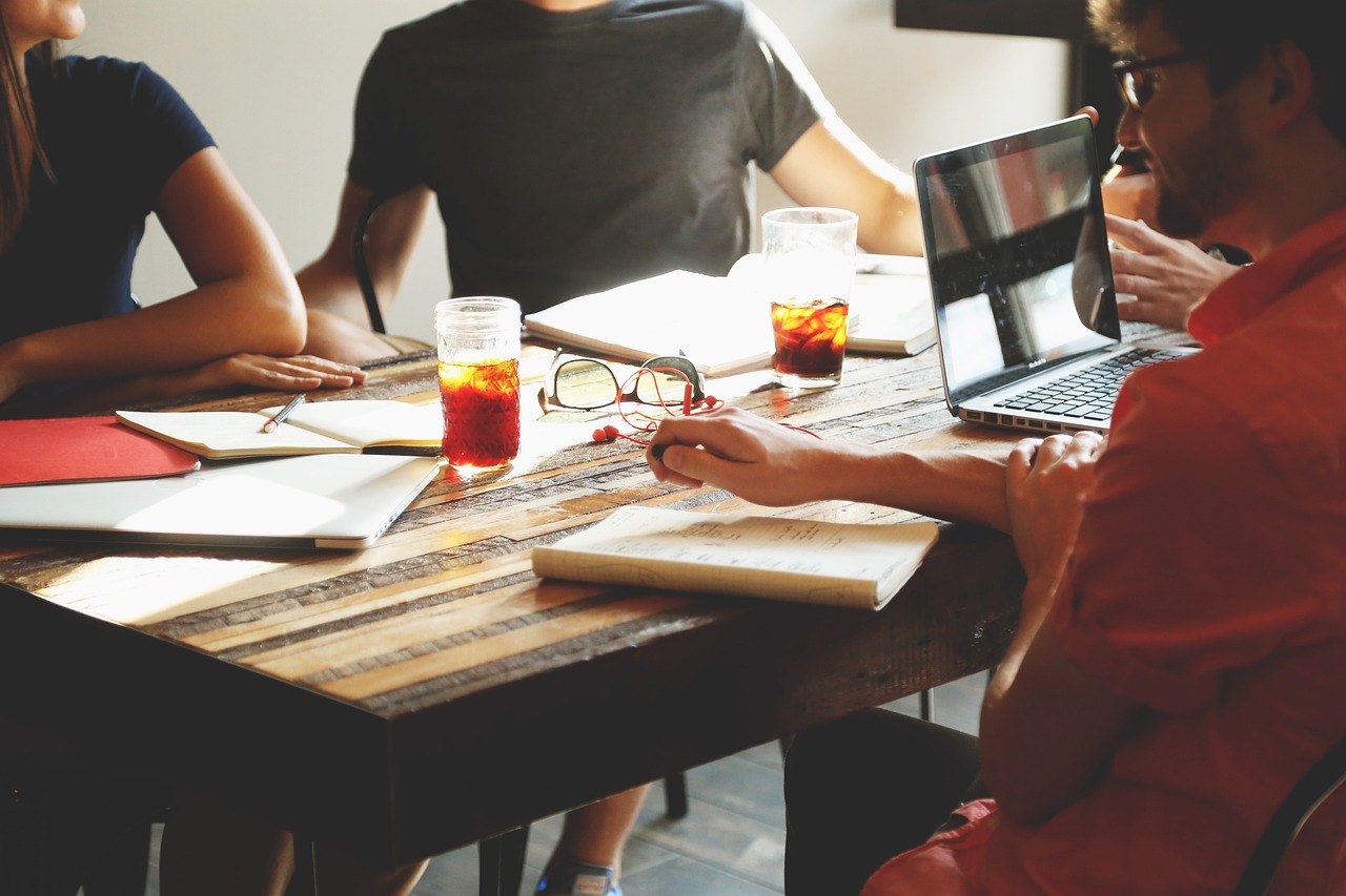 photo of people working avoiding the 8 mistakes of building and developing a business continuity plan at a desk in the office. 
